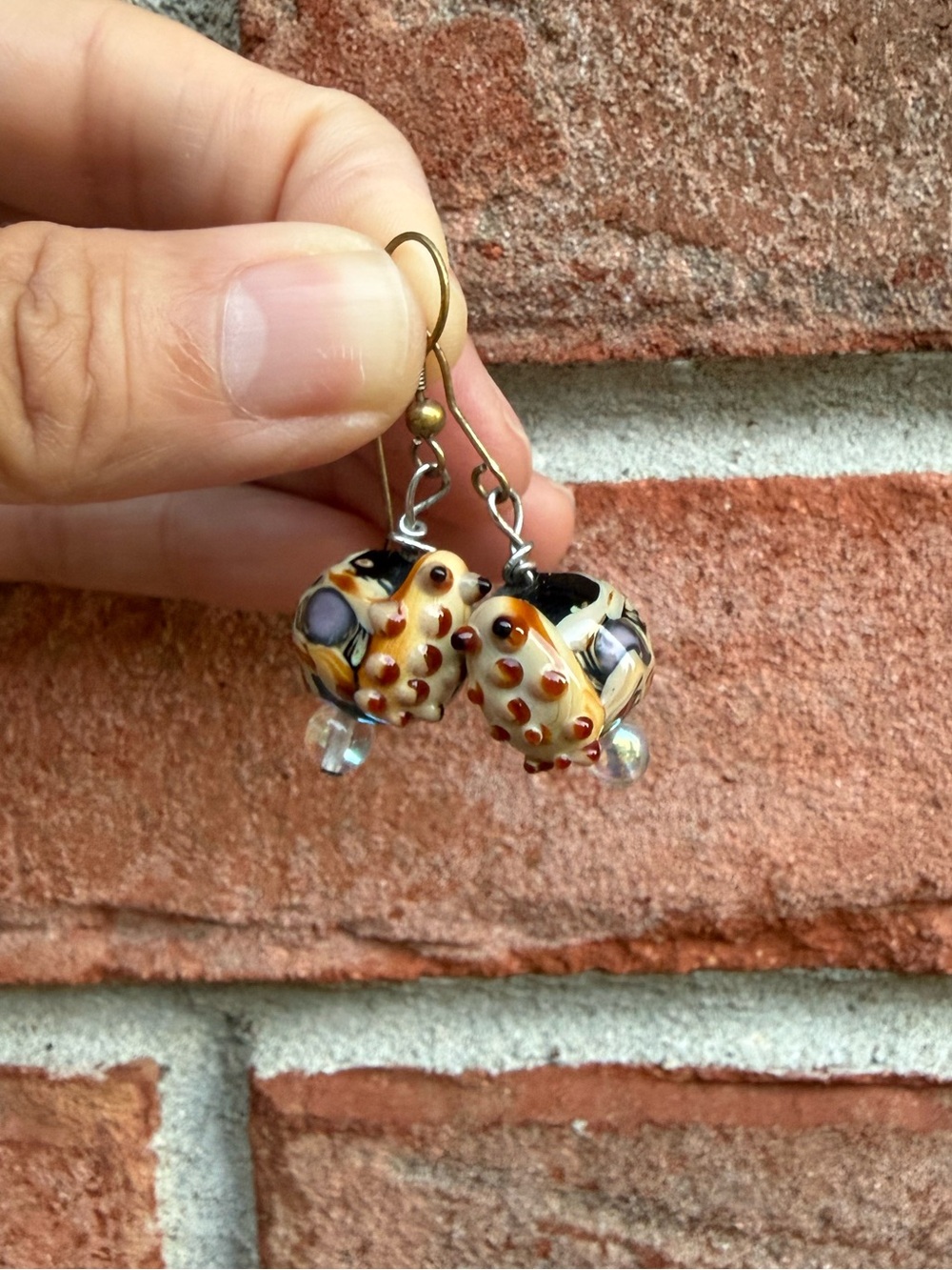 Lampwork Glass frog/toad on a bead dangling earrings.